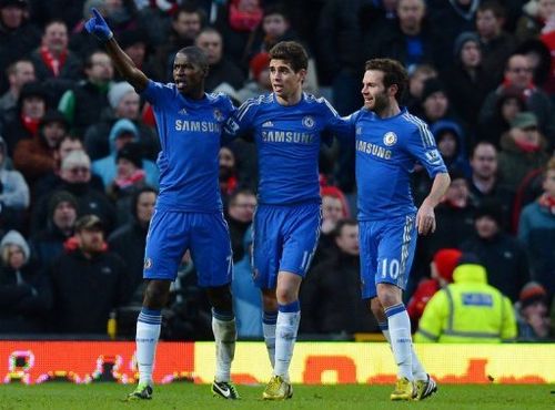 Chelsea's Ramires (L) celebrates with teammates Oscar (C) and Juan Mata during their match on March 10, 2013