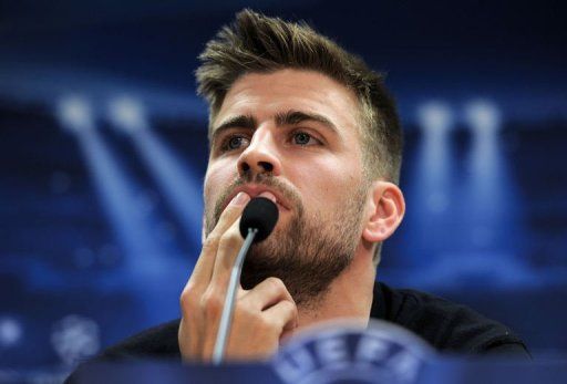 Barcelona&#039;s defender Gerard Pique gives a press conference in Sant Joan Despi, near Barcelona, on March 11, 2013