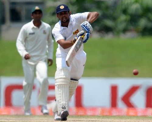 Tillakaratne Dilshan plays a shot during the final day of the opening Test against Bangladesh on March 12, 2013 in Galle