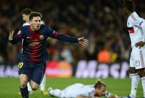 Barcelona's Lionel Messi celebrates his second goal against Milan on March 12, 2013