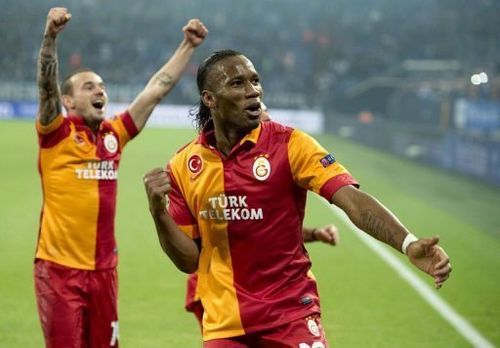 Galatasaray's Didier Drogba (R) and Wesley Sneijder celebrate beating Schalke on March 12, 2013