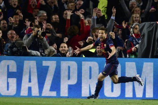 Barcelona defender Jordi Alba celebrates his late goal against AC Milan at Camp Nou on March 12, 2013