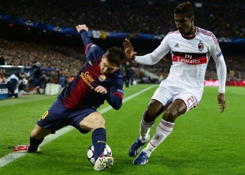 Barcelona's Lionel Messi (L) vies with AC Milan's Kevin Constant at Camp Nou stadium in Barcelona on March 12, 2013