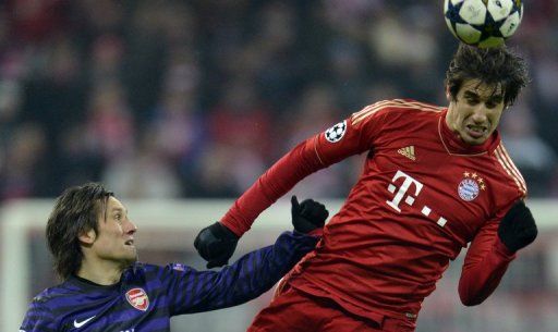 Bayern Munich&#039;s Javier Martinez out-jumps Tomas Rosicky during the UEFA Champions League match on March 13, 2013