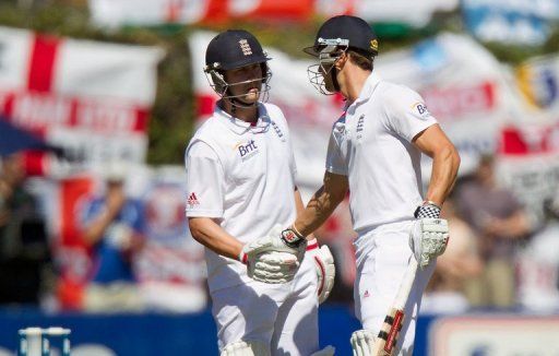 Nick Compton (R) earns a handshake from Jonathan Trott on March 14, 2013