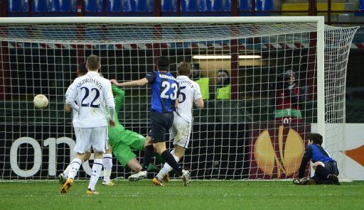 Inter Milan&#039;s Riccardo Alvarez (R) scores during their European Cup match against Tottenham, on March 14,  2013
