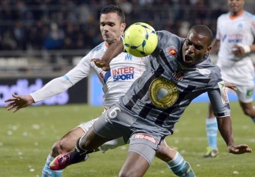 Marseille's defender Jeremy Morel  (L) vies with Ajaccio's midfielder Carl Medjani on March 15, 2013