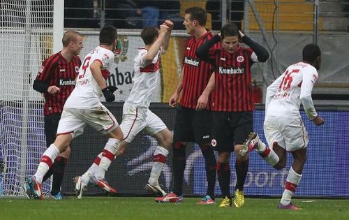 Frankfurt's players react as Stuttgart's Georg Niedermeier (3rd L) celebrates in Frankfurt am Main on March 17, 2013