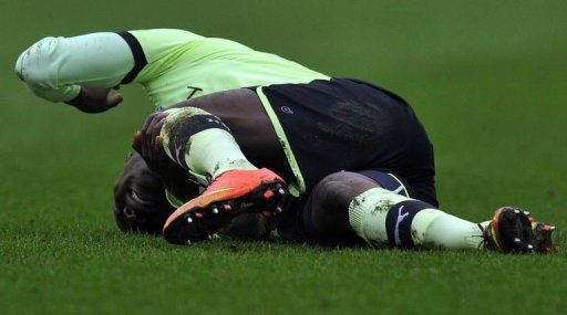 Newcastle United&#039;s Massadio Haidara is injured after a tackle at The DW Stadium in Wigan on March 17, 2013