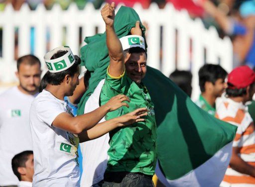 Pakistan fans celebrate at Sahara Stadium Kingsmead on March 21, 2013 in Durban