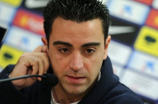 Spain midfielder Xavi Hernandez answers questions during a press conference in Barcelona, on February 21, 2013