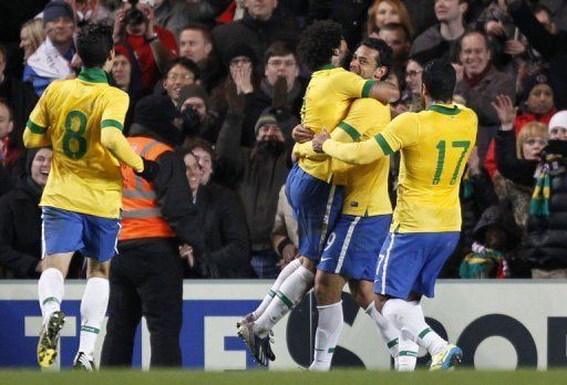 Brazil striker Fred (2R) celebrates scoring the equaliser against Russia at Stamford Bridge on March 25, 2013