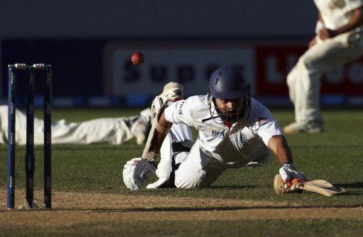 England&#039;s Monty Panesar dives to make a run against New Zealand on March 26, 2013