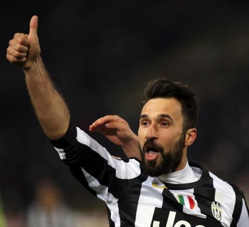 Mirko Vucinic celebrates scoring against Bologna on March 16, 2013