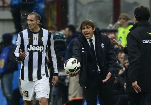 Juventus' coach Antonio Conte gestures with a ball on March 30, 2013, at the San Siro stadium in Milan