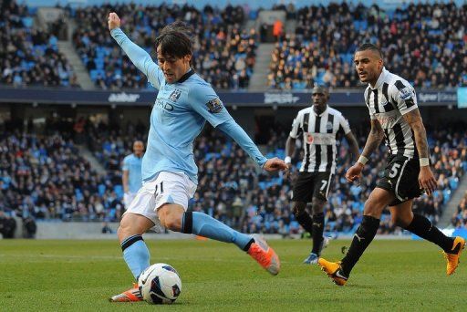 Manchester City midfielder David Silva scores the second goal in the win over Newcastle United on March 30, 2013