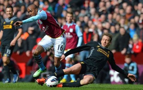 Aston Villa'sFabian Delph (left) vies with Liverpool's Lucas Leiva at Villa Park in Birmingham on March 31, 2013