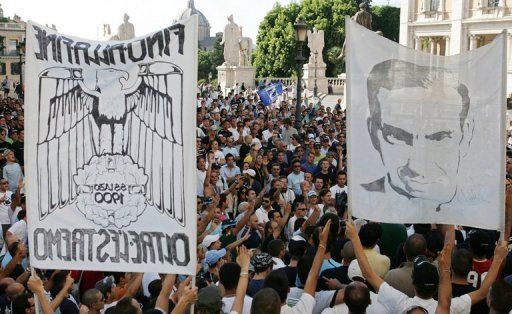 Lazio&#039;s supporters hold a portrait of Paolo di Canio during a rally in the piazza del Campidoglio in Rome, 21 July 2006