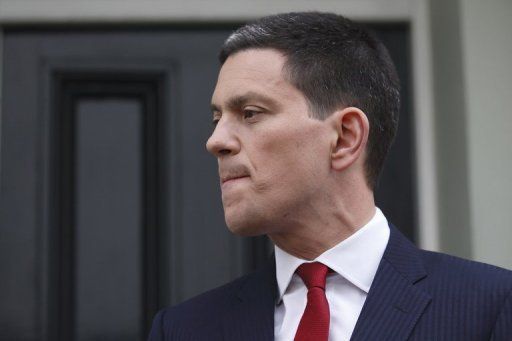 Former British foreign secretary David Miliband stands outside his house in London on March 27, 2013