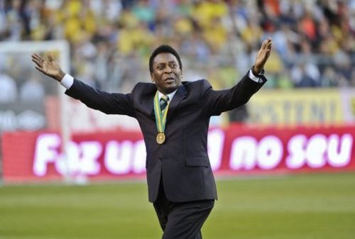 Football legend Pele greets the crowds at Rasunda stadium in Stockholm on August 15, 2012