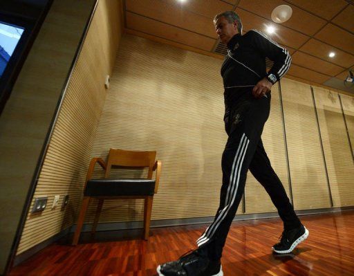 Jose Mourinho leaves after a press conference at Santiago Bernabeu stadium in Madrid on April 2, 2013