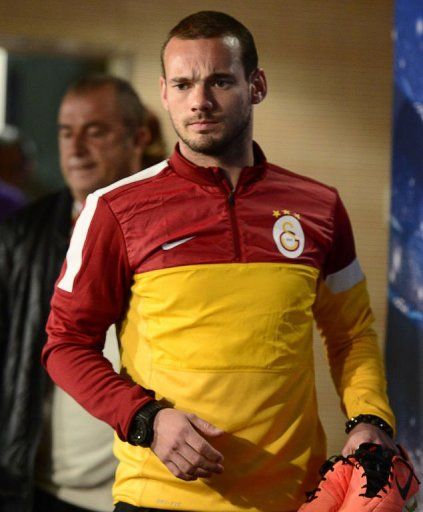 Wesley Sneijder arrives for a press conference at the Santiago Bernabeu stadium in Madrid on April 2, 2013