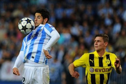 Malaga's Isco (L) vies with Dortmund's Lukasz Piszczek in Malaga on April 3, 2013