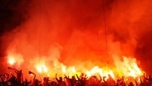 Galatasaray&#039;s supporters light flares on April 3, 2013 at Santiago Bernabeu stadium in Madrid