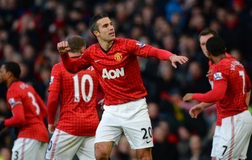 Robin van Persie celebrates after scoring in the Permier League against Sunderland at Old Trafford on December 15, 2012