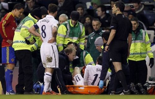 Tottenham Hotspur's Gareth Bale (C) is stretchered off at White Hart Lane in London on April 4, 2013