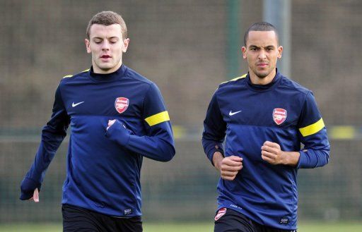 Arsenal&#039;s Jack Wilshere (L) and Theo Walcott are seen during a training session in north London, on February 18, 2013