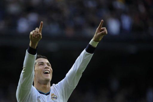 Real Madrid&#039;s forward Cristiano Ronaldo celebrates after scoring in Madrid on April 6, 2013