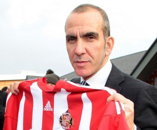 Sunderland manager Paolo Di Canio poseds with the team shirt in Sunderland, northeast England, on April 2, 2013