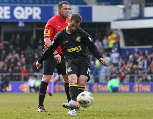 Wigan midfielder Shaun Maloney scores a late free-kick to salvage a draw at QPR on April 7, 2013