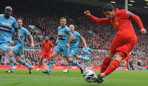 Liverpool striker Luis Suarez tries a trick against West Ham on April 7, 2013