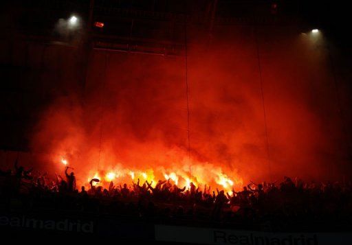 Galatasaray&#039;s supporters light flares during the first leg on April 3, 2013 in Madrid