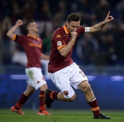 AS Roma's Francesco Totti celebrates after scoring on April 8, 2013 at the Olympic stadium in Rome