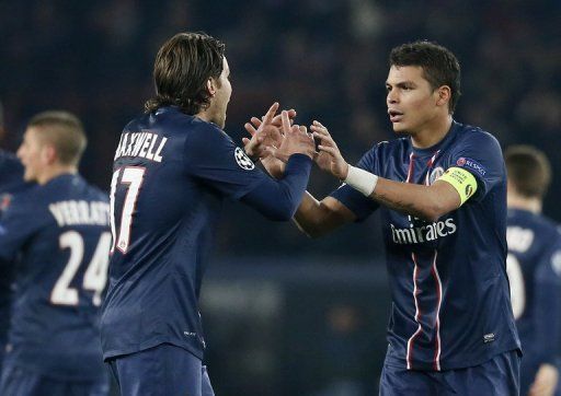 Paris Saint-Germain&#039;s Thiago Silva (R) and Maxwell are pictured during their match against Barcelona on April 2, 2013