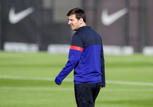 Barcelona forward Lionel Messi takes part in a team training session in Barcelona on April 9, 2013