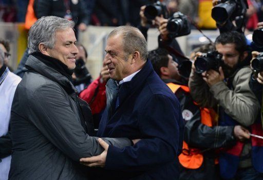 Real Madrid&#039;s Jose Mourinho (L) greets Galatasaray&#039;s Fatih Terim ahead of their Champions League match on April 9, 2013