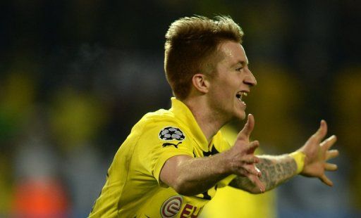 Dortmund&#039;s Marco Reus celebrates after scoring the equaliser against Malaga on April 9, 2013