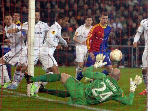 Tottenham Hotspur&#039;s goalkeeper Brad Friedel dives for a save on April 11, 2013