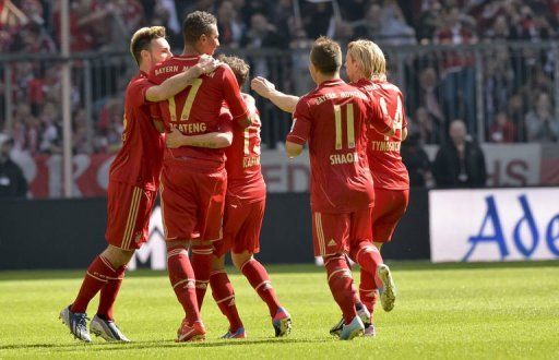 Bayern&#039;s Jerome Boateng (2ndL) celebrates during Nuremberg game in Munich, on April 13, 2013