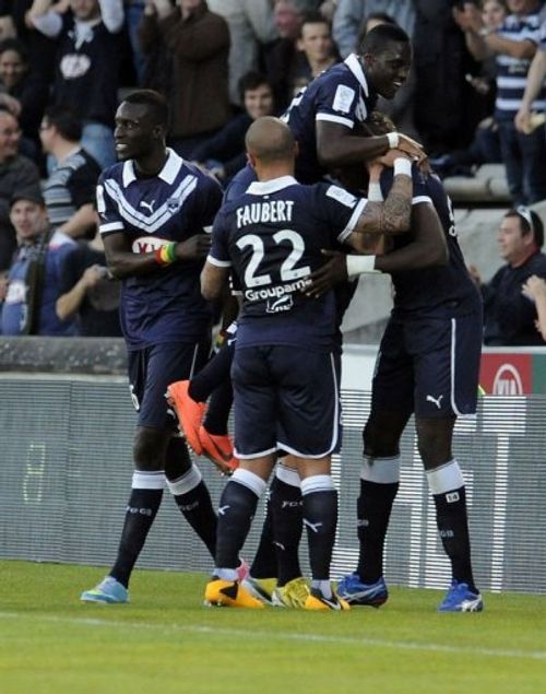 Bordeaux' players celebrate after scoring, April 13, 2013 at the Chaban-Delmas Stadium in Bordeaux