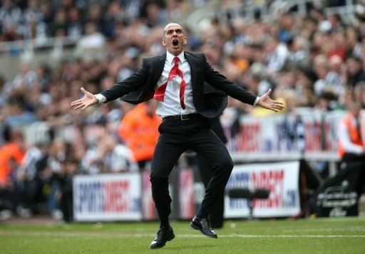 Paolo Di Canio celebrates after his team scored the first goal in Newcastle, on April 14, 2013