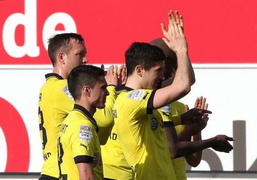 Dortmund players celebrate after a Bundesliga match against Greuther Fuerth in Fuerth, on April 13, 2013