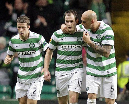 Celtic&#039;s Anthony Stokes (centre) celebrates after scoring a goal at a Europa League match in Glasgow on November 3, 2011