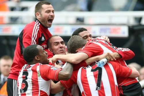 Sunderland's Paolo Di Canio (C) celebrates with his players at St James' Park in Newcastle, on April 14, 2013