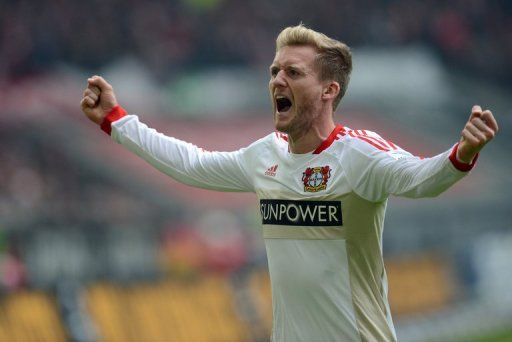 Leverkusen&#039;s striker Andre Schuerrle celebrates scoring in Duesseldorf on March 30, 2013