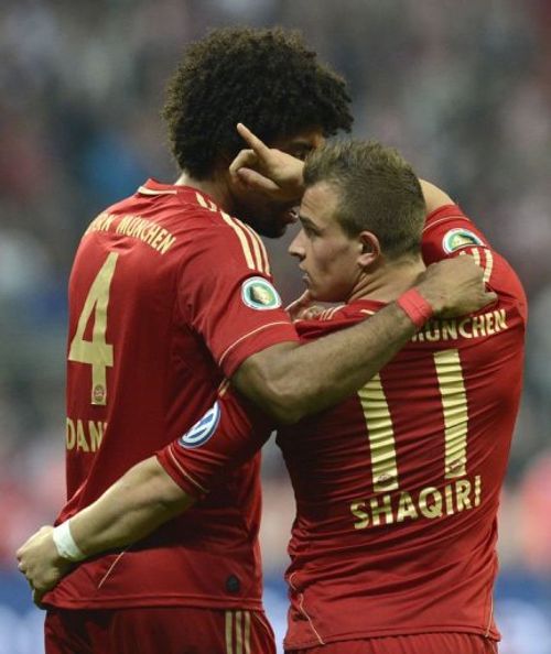 Bayern Munich's Xherdan Shaqiri (R) and Dante celebrate in Munich on April 16, 2013